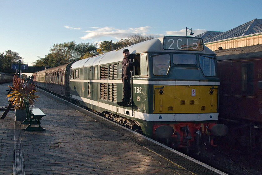 D5631, 16.31 Holt-Sheringham, Sheringham station 
 The final service train of the day on the North Norfolk Railway arrives at Sheringham station. D5631 (31207) leads the 16.31 departure from Holt into the station with the secondman nonchalantly hanging out of the cab as it comes to a halt. D5631 has been a resident locomotive on the Poppy Line for many years arriving in 2003 after a lengthy period of storage at Old Oak Common. It has been a stalwart of their operations since then having undergone a number of overhauls and wearing various liveries. 
 Keywords: D5631 16.31 Holt-Sheringham Sheringham station A1A A1A