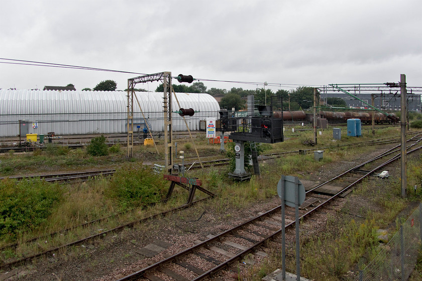 Bescot depot (Closed) 
 Bescot TMD, seen here, used to be absolutely packed with locomotives undergoing fueling and maintenance - how things have changed! It is now empty and disused with freight operators looking after their own locomotives at various allocated areas elsewhere in the vast expanse of the yard to the south. Plans have recently been thrown out to construct a plant to manufacture sleepers for Network Rail on this site following a huge local backlash. Just days after the rejection of this plan, a new one was submitted by West Midlands Trains to build a large new depot for the maintenance of their electric fleet. Following the planning submission at the end of January 2020, the COVID-19 pandemic may well have altered and slowed the plan as I have heard little more information about it since. 
 Keywords: Bescot depot