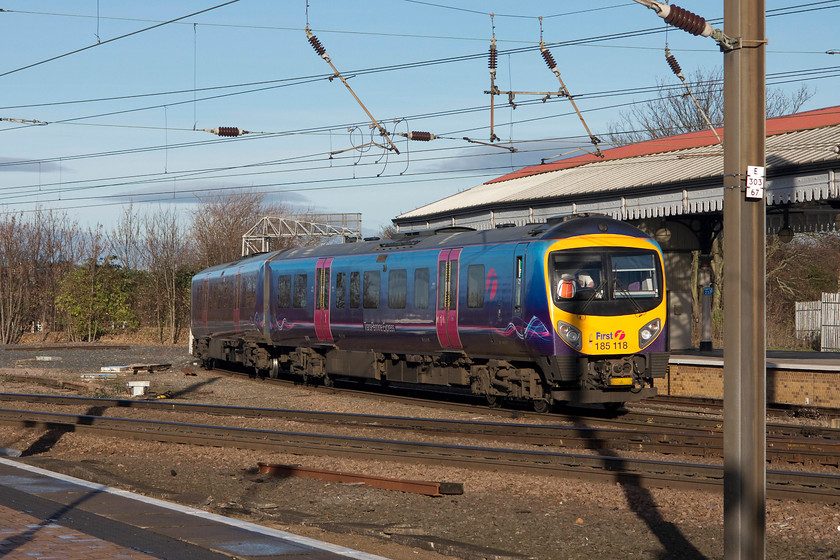 185118, TP 10.22 Liverpool Lime Street-Scarborough (1E84), York station 
 Having arrived at York, a little late, the sun had put in a appearance and it was turning into a bright, if a little chilly, winter's day. 185118 leaves York station with the 10.22 Liverpool Lime Street to Scarborough. This TPE livery is very similar to FGW's HSTs, not surprising really as they are owned by the same parent group First Group. 
 Keywords: 185118 10.22 Liverpool Lime Street-Scarborough 1E84 York station