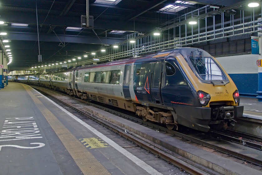 221114, VT 13.02 London Euston-Chester (1D87, 1E), London Euston station 
 Still here and polluting Euston (and all other stations on the Avanti network for that matter)! Avanti's 221114 sits idling at Euston waiting to work the 13.02 service to Chester. Soon the new bi-mode Class 805s will take over these services and not before time! However, I hear that two new operators are likely to take them on running services from Shrewsbury and Wrexham and also Stirling both to Euston via the WCML so they may be back! 
 Keywords: 221114 13.02 London Euston-Chester 1D87 London Euston station AWC Avanti West Coast Voyager