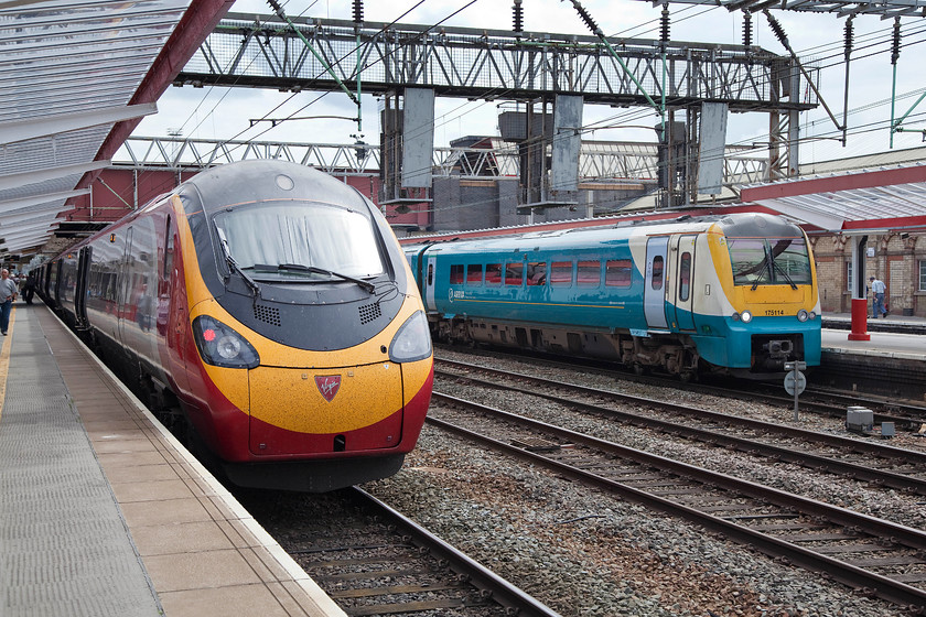 390114, VT 13.47 Liverpool Lime Street-London Euston (1A42), & 175114, AW 09.10 Milford Haven-Manchester Piccadilly (1W57), Crewe station 
 390114 'City of Manchester' waits at Crewe station forming the 13.47 Lime Street to London Euston. To the right 175114 is ready to leave with the final leg of its journey to Manchester Piccadilly as the 09.10 from Milford Haven 
 Keywords: 390114 13.47 Liverpool Lime Street-London Euston 1A42 175114 09.10 Milford Haven-Manchester Piccadilly 1W57 Crewe station