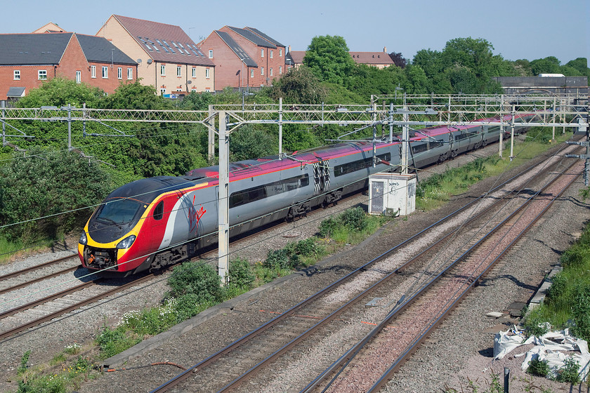 390114, VT 05.40 Glasgow Central-London Euston (1M06), site of Roade station 
 390114 'City of Manchester' passes the site of Roade station forming the 05.40 Glasgow Central to Euston. This is the first up Anglo-Scottish service of the day. 
 Keywords: 390114 05.40 Glasgow Central-London Euston 1M06 site of Roade station