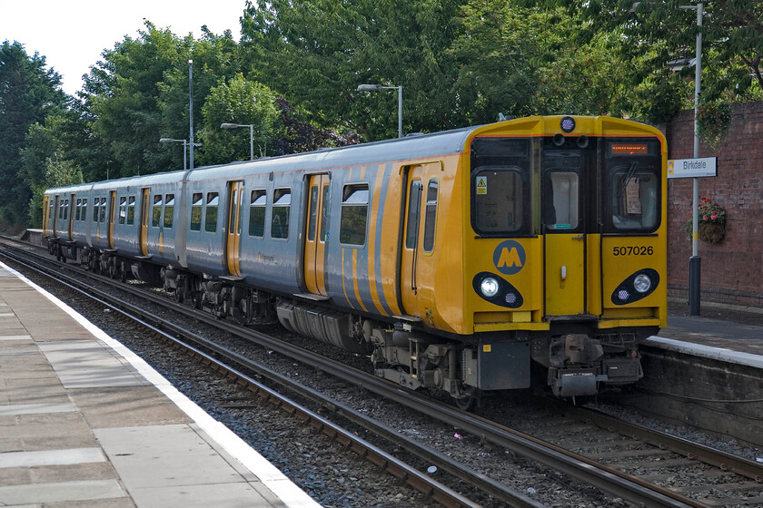 507026, ME 16.06 Hunts Cross-Southport, Birkdale station 
 507026 works the 16.06 Hunts Cross to Southport service into Birkdale station. This town is, of course, home to the world-famous Royal Birkdale Golf Club which has hosted many tournaments over the years including the Masters. However, the club is located well south of the town with the nearest station actually being Hillside. 
 Keywords: 507026 16.06 Hunts Cross-Southport Birkdale station Merseyrail