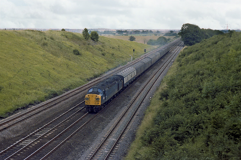 40131, down parcels, Westby SK962271 
 A photograph that could have been taken some years earlier than August 1978. 40135 climbs Stoke Bank past Westby with a down parcels working. Note that it is carrying a reporting number of 3S55. The displaying of the alpha numeric identifiers had been abandoned from the start of 1976 so to see the class 40 proudly wearing this one was unusual. I am not absolutely sure if the driver had set it for this particular train but a class 3 (parcels) is correct and S for Scotland is quite possible. 
 Keywords: 40131, down parcels, Westby SK962271