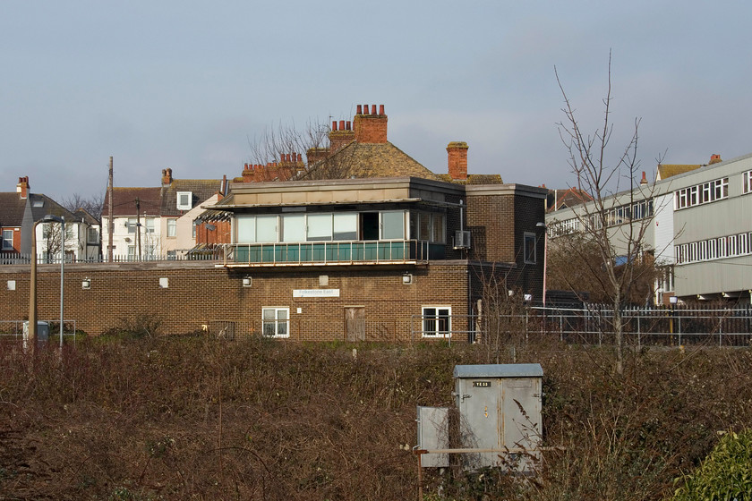 Folkestone East signal box (BR, 1962) 
 Folkestone East signal box took some finding after resorting to studying Google Earth on my mobile 'phone! Andy and I eventually tracked it down by driving into Highfield Industrial estate. Right at the top end of the estate, this view of the box was revealed above a stack of accident damaged cars awaiting repair! The box is rarely photographed due to its location and I have found precious amount of information about it, apart from it being a British Railways structure dating from 1962. The box sits on the disused platform of Folkestone East station that was closed in September 1965. According to my relatively up to date track atlas, there is a Folkestone East Staff halt still in existence. As the name suggests, it is for staff needing to get to the stabling point and sidings just east of Folkestone. This is a similar situation to that found at Hoo Junction Staff halt, that Andy and I visited last year during our previous trip to Kent. 
 Keywords: Folkestone East signal box