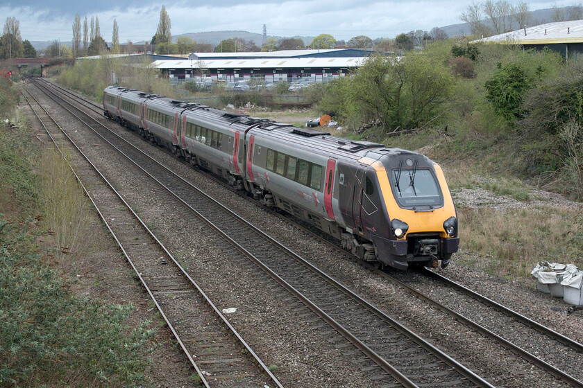 221137, XC 06.11 Leeds-Plymouth (1V44, 14L), Arle bridge 
 Approaching Arle bridge from the north 221137 is slowing for its stop at Cheltenham Spa working the 1V44 06.11 Leeds to Plymouth service. Back in the 1980s the waste land behind the train and further space now occupied by the large units was home to a coal concentration yard that was rail connected. It also had a small resident diesel shunter that chuntered about moving wagons. 
 Keywords: 221137 06.11 Leeds-Plymouth 1V44 Arle bridge XC CrossCountry Voyager