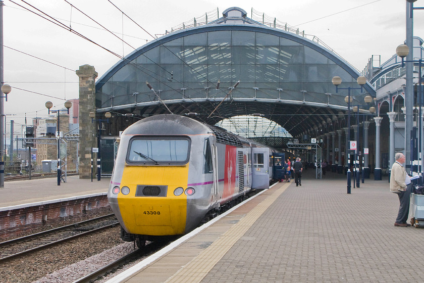 43308 VTEC 14.30 Edinburgh Waverley-London King`s Cross (1E19), Newcastle station 
 Under the renovated trainshed at Newcastle station, the 14.30 Edinburgh Waverley to King's Cross service has come to a halt at platform four. The rear power car is 43308 'Highland Chieftain' still wearing its National Express East Coast livery despite the operator going out of operation in 2009 after 'handing the keys back' to the Department for Transport who then took over operations. 
 Keywords: 43308 14.30 Edinburgh Waverley-London King`s Cross 1E19 Newcastle station hst Virgin East Coast