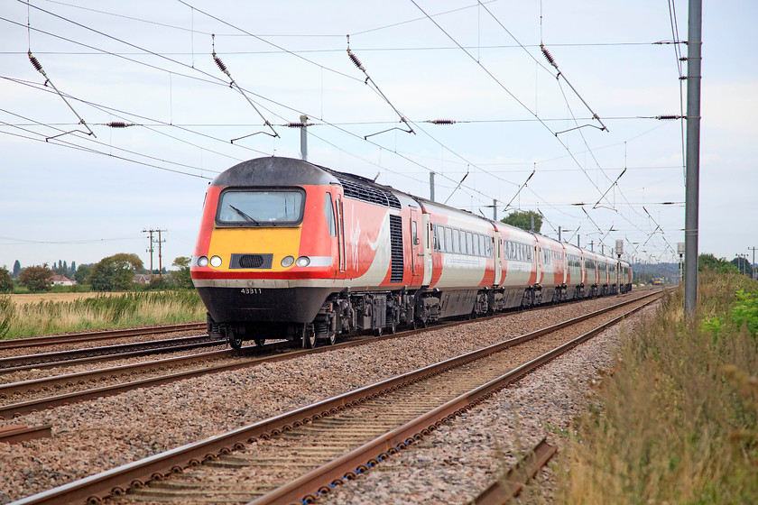 43311 & 43299, 07.34 Harrogate-London Kings Cross (1A14, 4L), Langford TL192404 
 The sight of an HST at full chat on the mainline is still and impressive one! Even though the sound is not quite the same as when the Paxman Valenta 12RP200L engines were fitted with their screaming turbo chargers! At Langford just south of Biggleswade 43311 leads with 43299 on the rear working the 07.34 Harrogate to London King's Cross. 43299 was the last of the first batch delivered to the Eastern Region in 1979 as 43099 that was part of set 254022. 
 Keywords: 43311 43299 1A14 Langford TL192404