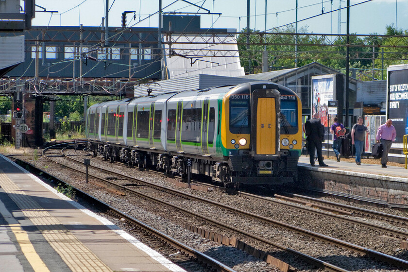 350116, LM 10.13 London Euston-Birmingham New Street (1Y21), Northampton station 
 Under glorious July skies 350116 pauses at Northampton station working the 1Y21 10.13 Euston to Birmingham London Midland service. 
 Keywords: 350116 10.13 London Euston-Birmingham New Street 1Y21 Northampton station London Midland Desiro