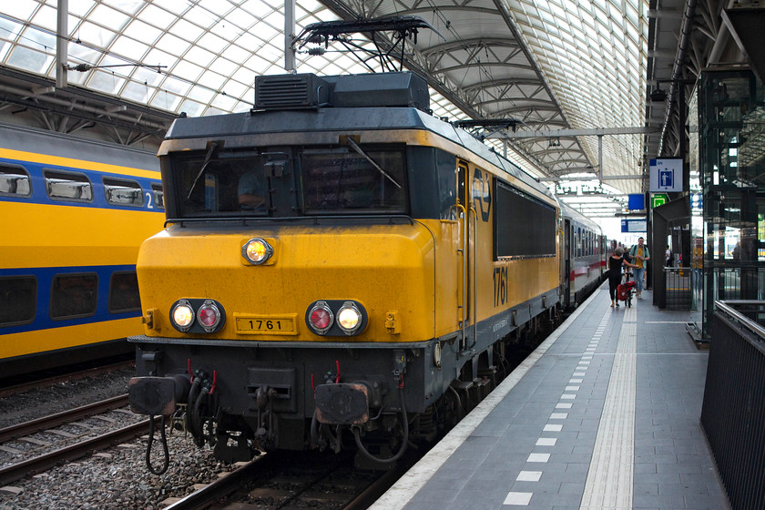 1761, 17.00 Amsterdam Central-Hannover Hbf (Int. 241), Amsterdam Central station 
 1761 waits to leave Amsterdam central station heading the 17.00 International train to Hannover HBf. This really is a 'proper' European train being loco. hauled, crossing international borders and having long rake of comfortable coaches. Also, many of the coaches (both first and second class) were compartment stock. I was very envious looking through the windows, the comfy compartments reminded me of a era on the UK network that has long gone! It was interesting to note that these DB coaches were not ancient throwbacks from the 1960s but were built in the mid 2000s. 
 Keywords: 1761 17.00 Amsterdam Central-Hannover Hbf Int. 241 Amsterdam Central station