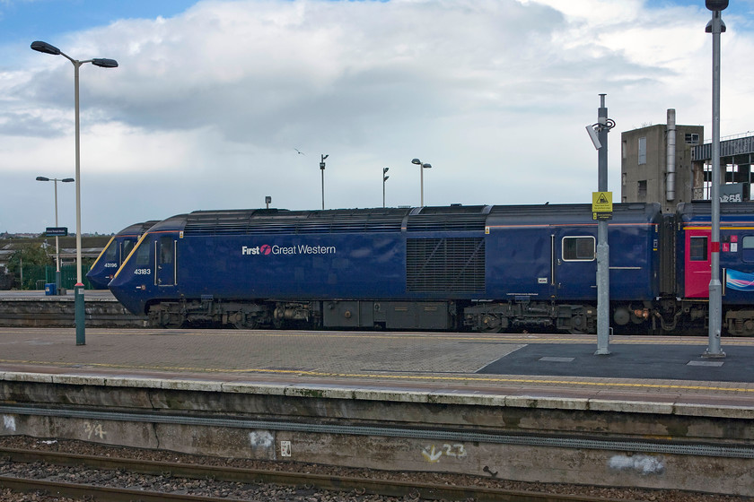 43196, GW 15.00 Bristol Temple Meads-London Paddington (1A22) & 43183, GW 14.33 Bristol Temple Meads-London Paddington (1A21), Bristol Temple Meads station 
 Two HSTs stand at the eastern end of Temple Meads station ready to work services to Paddington. 43196 will form the 1A22 15.00 departure, whilst 43183 will leave first with the 1A21 14.33 service. Notice in the background the derelict remains of the former Royal Mail sorting office that was rail connected via a ghastly bridge that totally spoiled the eastern approach to the station until its recent demolition. 
 Keywords: 43196 15.00 Bristol Temple Meads-London Paddington 1A22 43183 14.33 Bristol Temple Meads-London Paddington 1A21 Bristol Temple Meads station