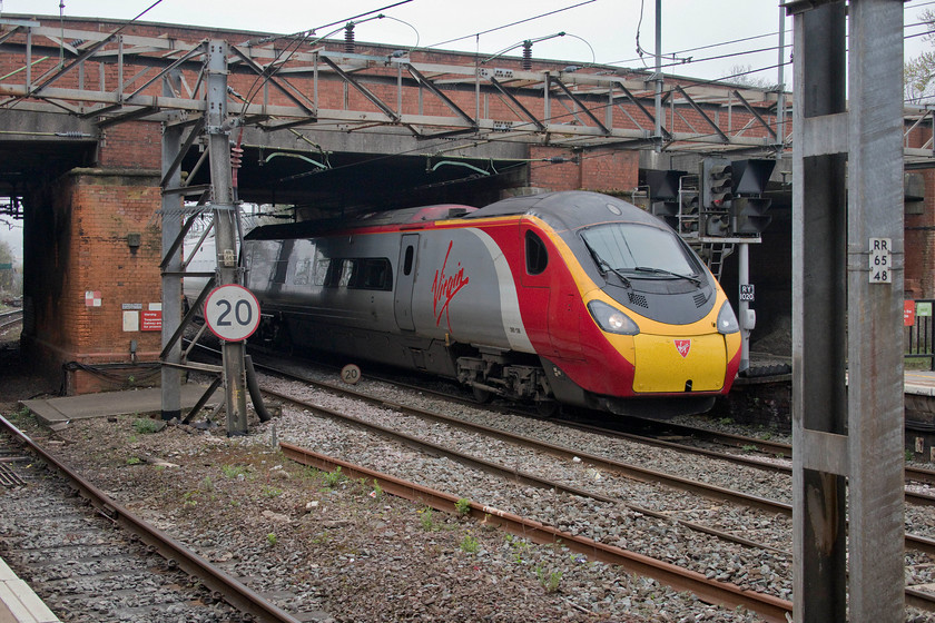 390136, VT 08.51 London Euston-Wolverhampton (9G02, RT), Northampton station 
 390136 'City of Coventry' passes through Northampton station with the diverted 08.51 Euston to Wolverhampton service. It is not unusual for trains to be diverted off the Weedon loop on Sunday mornings following engineering works on this section of line. 
 Keywords: 390136 08.51 London Euston-Wolverhampton 9G02 Northampton station