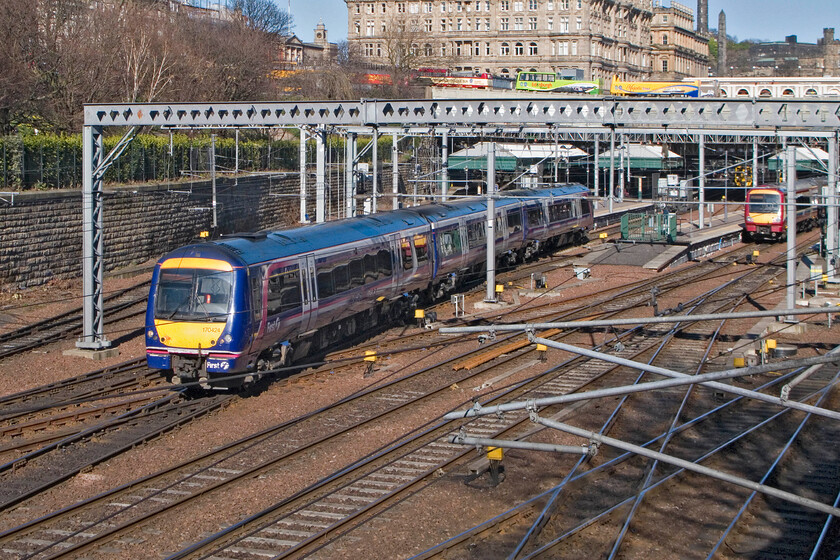 170424, SR 16.29 Edinburgh Waverley-Inverurie Edinburgh Waverley station from The Mound 
 Worked by Turbo unit 170424 works the 16.29 Edinburgh to Inverurie ScotRail service out of what will now be becoming an increasingly busy Waverley station. What with the huge number of tourists that visit the magnificent city of Edinburgh and the peak time workers arriving (In the morning) and leaving at this time to get home Waverley station is extremely busy as well as being a crossing point from one side of the city to the other. 
 Keywords: 170424 16.29 Edinburgh Waverley-Inverurie Edinburgh Waverley station from The Mound ScotRail