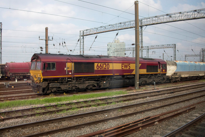 66120, stabled, Wembley Yard 
 66120 sits in Wembley Yard at the head of an unidentified bulk train. 
 Keywords: 66120 Wembley Yard