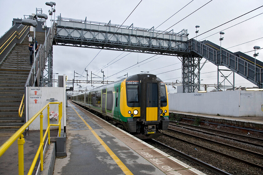 350241, ECS for LM 09.16 Northampton-Birmingham New Street (ex 07.54 London Euston-Birmingham New Street) (2Y17), Northampton station 
 With Northampton's 'temporary' station footbridge still dominating the northern end of the platforms, our first train of the day arrives at number two as empty coaching having just terminated at platform one as the 07.54 from Euston. Andy and I took the 2Y17 09.16 service to Birmingham New Steet arriving about an hour later. 
 Keywords: 350241 ECS 09.16 Northampton-Birmingham New Street 07.54 London Euston-Birmingham New Street 2Y17 Northampton station