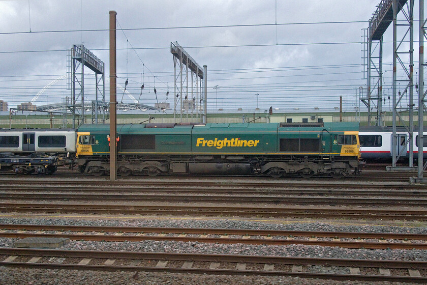 66506, unidentified up Freightliner, Wembley Yard 
 Despite searching various sources and with all the internet tech. at my disposal, I have not been able to identify this Freightliner service stabled in Wembley Yard! 66506 'Crewe Regeneration' sits at the head of the up service with a crew member on the steps of the rear cab. If anybody out there can assist with my quest to identify the train, please do get in contact. 
 Keywords: 66506 up Freightliner Wembley Yard Crewe Regeneration