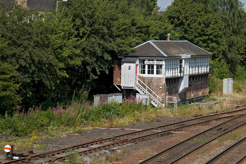 Stirling North signal box (Caledonian, 1900) 
 Stirling North signal box is classified as an A structure by Historic Environment Scotland not as a stand-alone structure but as part of the wider station environment that should secure its future even once it is made redundant by the arrival of the forthcoming electrification. It is a later Type 2 Caledonian box dating from 1900. It is of brick and timber with piended roof. It has a traditional four-pane glazing pattern to four round-arched openings to the frame room. The operating room has six-pane timber glazing with twenty-one windows running length of trackside elevation. Unusually it has a twin bay projecting to left of centre. It contains a forty-eight lever frame. Notice the rarely used disc shunt signals (SN3) for the down north siding exit. 
 Keywords: Stirling North signal box Caledonian