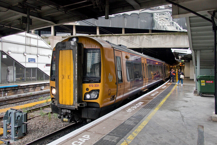 172331, LN 08.00 Birmingham New Street-Hereford (1V22, 10L), Birmingham New Street station 
 Sheltering from the rain at New Street station I managed a photograph of West Midlands Trains' 172331 that was preparing to leave working the 1V22 08.00 service to Hereford. It is sobering to think that the Class 172 Turbostars have been in operation now for thirteen years! I still consider them to be the 'new kids on the block' whenever I see them around the West Midlands! 
 Keywords: 172331 08.00 Birmingham New Street-Hereford 1V22 Birmingham New Street station West Midlands Trains