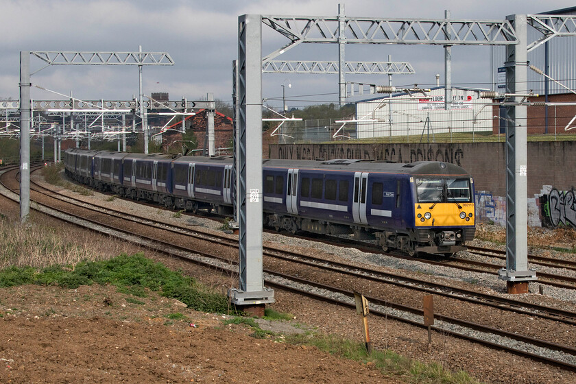 360110, 08.26 Kentish Town-Kettering stabling sidings (3Y51, 11L), Irthlingborough Road bridge 
 Soon to enter service on the MML between St. Pancras and Corby the former Greater Anglia Class 360 Desrios have been undergoing extensive test runs and driver training turns. Unfortunately, I did not manage the details of the leading unit but 360110 is bringing up the rear of the 08.26 Kentish Town to Kettering 3Y51. It is seen approaching Wellingborough from the IrthlingboroughRoad bridge travelling on the down slow line. 
 Keywords: 360110 08.26 Kentish Town-Kettering stabling sidings 3Y51 Irthlingborough Road bridge Desiro