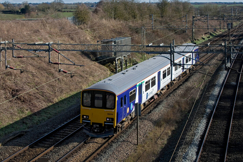 150114, 14.14 Wolverton Centre Sidings-Newton Heath TMD (5N32, 73E), Victoria bridge 
 Just as I arrived at Victoria bridge, the 5N32 14.14 Wolverton Centre Sidings to Neaton Heath empty stock move came into view. Wolverton Works has worked their magic on 150114 refurbishing it to be ready for some more years of service with Northern. The flow of stock in and out of the Gemini facility indicates that a healthy amount of work is being undertaken by the former London and Birmingham Railway works. 
 Keywords: 150114 14.14 Wolverton Centre Sidings-Newton Heath TMD 5N32 Victoria bridge Northern