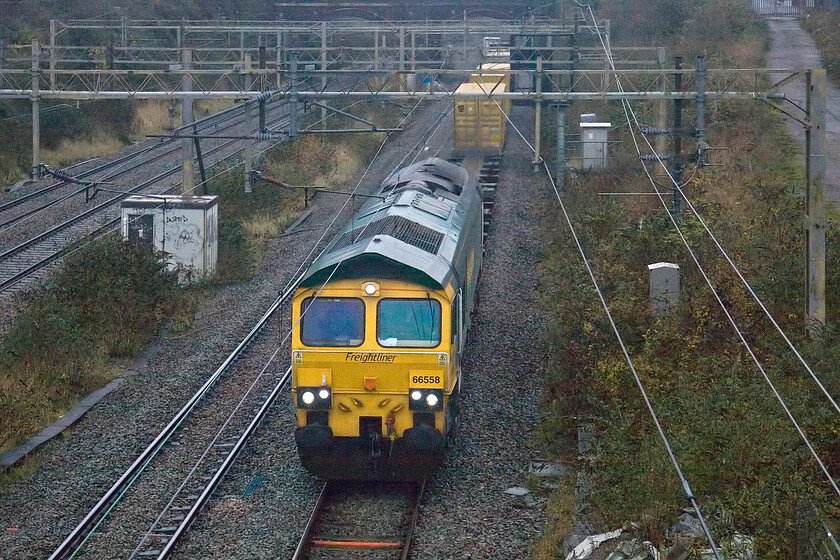 66558, 03.14 Garston-Felixstowe North (4L97, 3E), site of Roade station 
 Running just a few minutes behind the last up GBRF freight the 03.14 Garston to Felixstowe 4L97 Freightliner heads south past Roade led by 66558. 
 Keywords: 66558, 03.14 Garston-Felixstowe North (4L97, 3E), site of Roade station