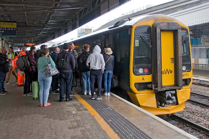 158771, GW 13.30 Cardiff Central-Portsmouth Harbour (1F19, 3L), Bristol Temple Meads station 
 With the possible cancellation of an adjacent GWR IET service to Paddington passengers for Bath were encouraged to join the 13.30 Cardiff to Portsmouth Harbour service and this is what is happening here! Andy and I travelled on the 1F19 along with these other passengers and it was pretty crowded and steamy on this wet afternoon! 
 Keywords: 158771 13.30 Cardiff Central-Portsmouth Harbour 1F19 Bristol Temple Meads station GWR