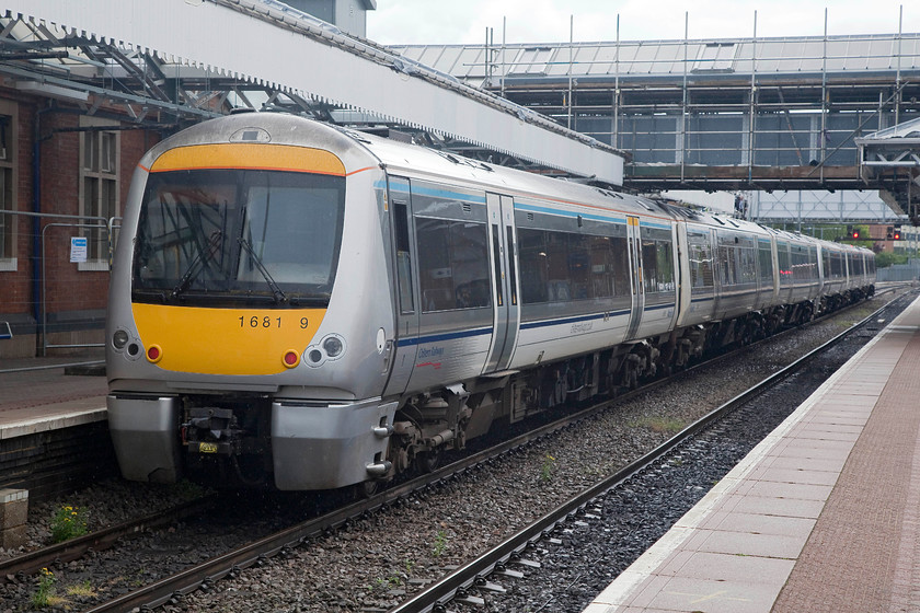 168109, CH 09.48 Aylesbury-London Marylebone (2C27, 2L), Aylesbury station 
 With one its middle numbers missing I had to identify this unit from its carriage number. 168109 waits at Aylesbury to work the 09.48 to London Marylebone. Note the work being undertaken to replace the perfectly serviceable footbridge because it did not meet disability requirements. 
 Keywords: 168109 2C27 Aylesbury station