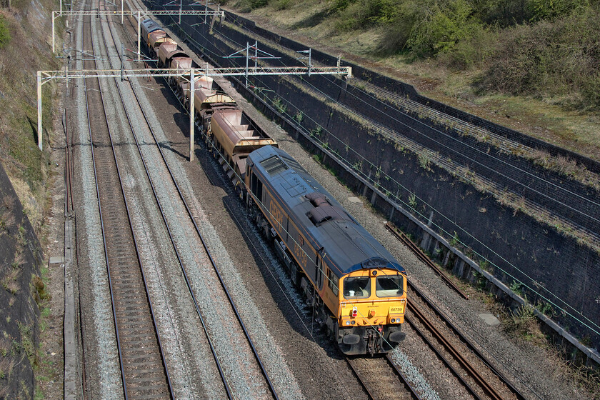 66759 & 66792, 08.30 Willesden No. 7-Bescot (6G54, 2E), Roade cutting 
 A pretty anonymous infrastructure train passes through Roade cutting. However, I was particularly pleased to see both of the GBRf locomotives at either end of it as they were both photographic cops! The 08.30 Willesden to Bescot 6G54 was being led by former Sweedish resident 66792 with 66759 'Chippy' bringing up the rear. 
 Keywords: 66759 66792 08.30 Willesden No. 7-Bescot 6G54 Roade cutting Chippy