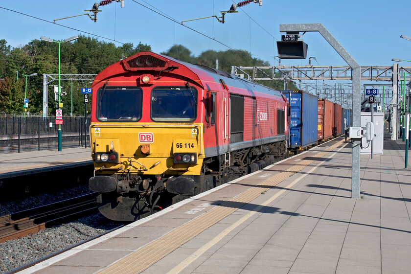 66114, 04.13 Wakefield Europort-Didcot TC (4V43, 7E), Bletchley station 
 4V43 the Wakefield to Didcot is not a regular visitor to the southern end of the WCML in fact, I think that this is only the second time that I have seen it and managed a photograph. It is usually routed around Birmingham via Walsall and Bescot to then continue its journey via Coventry and then to Leamington Spa to get to its destination via the GW Banbury route. I am not sure as to why it was off-route but it makes a fine sight as it speeds through Bletchley with a bright red 66114 at the helm. 
 Keywords: 66114 04.13 Wakefield Europort-Didcot TC 4V43 Bletchley station DB