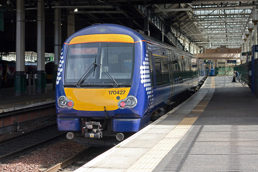 1704527, SR 12.15 Edinburgh Waverley-Glasgow Queen Street (1R51), Edinburgh Waverley station 
 170427 will leave platform 17 at Edinburgh Waverley station at 12.15 with the 1R81 service to Glasgow Queen Street. This service will travel via Polmont and Falkirk High to get reach Glasgow in just under an hour. In the coming few months, this service will go over to electric power as the masts continue their relentless march across Scotland including this route. 
 Keywords: 1704527 12.15 Edinburgh Waverley-Glasgow Queen Street 1R51 Edinburgh Waverley station