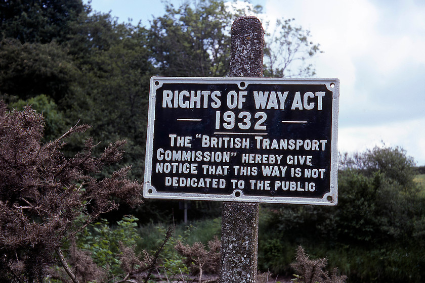 Former BTC sign, Whiteball 
 The former British Transport Commission (BTC) cast sign looks as though it has had a recent lick of paint despite the organisation having been abolished eighteen years previously. I suspect that the sign located on a farm occupation bridge near Whiteball is no longer in existence but I am happy to be advised otherwise. The BTC was created by Clement Attlee's post-war Labour government as a key tenet of its nationalisation policy and encompassed many organisations from the railways, the canals, road haulage and the police (by creating the BTP). This huge body was abolished in 1963 when the chair was the infamous Dr. Richard Beeching. 
 Keywords: Former BTC sign Whiteball British Transport Commission