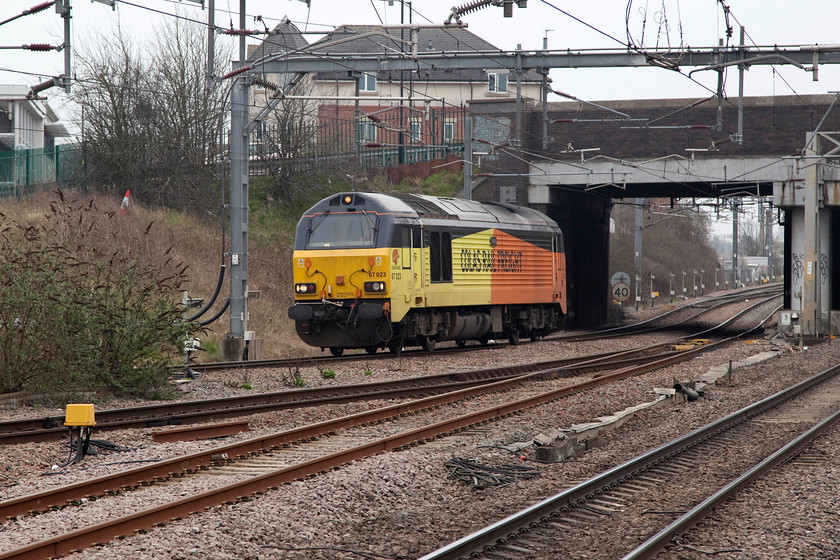 67023, 09.00 Derby RTC-Crewe Basford Hall, Nuneaton station 
 Due to the cancellation of our train from Nuneaton to Liverpool, we had an extended wait of about fifty minutes. Whilst my wife and son sat in the buffet I went on the wander camera in hand. As it was a Sunday morning, things were a bit quiet but I did capture Colas livered 67023 passing through light engine as the 09.00 Derby RTC to Crewe Basford Hall. A bit of a dull and miserable morning meant that the iso on the camera had to be ramped up a bit!