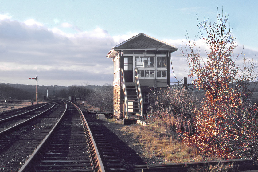 Clayton West Station Cabin signal box, looking west (L&Y, 1878) 
 A view looking westwards along the three and a half-mile long Clayton West branch with the completely unmolested Station Cabin signal box to the right. As it was Sunday, there were no services on the short branch that diverged from the Huddersfield to Penistone at Clayton Station Junction. The line was used to remove coal from the Park Mill mine that was closed in 1989. The sidings leading to the mine were on the wasteland to the left in this image 
 Keywords: Clayton West Station Cabin signal box, looking west Lancashire and Yorkshire Railway