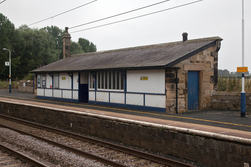 Waiting room, up platform, Acklington station 
 Another example of the North British style of waiting room found at a number of stations on this stretch of line. In this case, this one is at Acklington, being similar to the one at Chathill and the one seen earlier in the day at Drem, see.... https://www.ontheupfast.com/v/photos/21936chg/27318116204/x385017-11-12-edinburgh-waverley 
 Keywords: Waiting room up platform, Acklington station