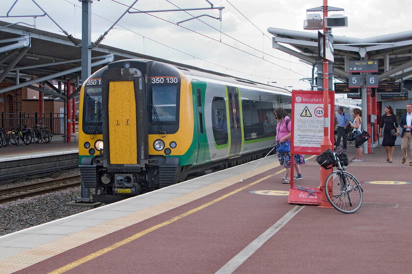 350130, LM 15.14 Birmingham New Street-London Euston (1Y58), Rugby station 
 My final train home arrives into a now very cloudy and stormy feeling Rugby station. My bike and I took the 15.14 Birmingham New Street to Euston train as far as Northampton. 
 Keywords: 350130 15.14 Birmingham New Street-London Euston 1Y58 Rugby station London Midland Desiro