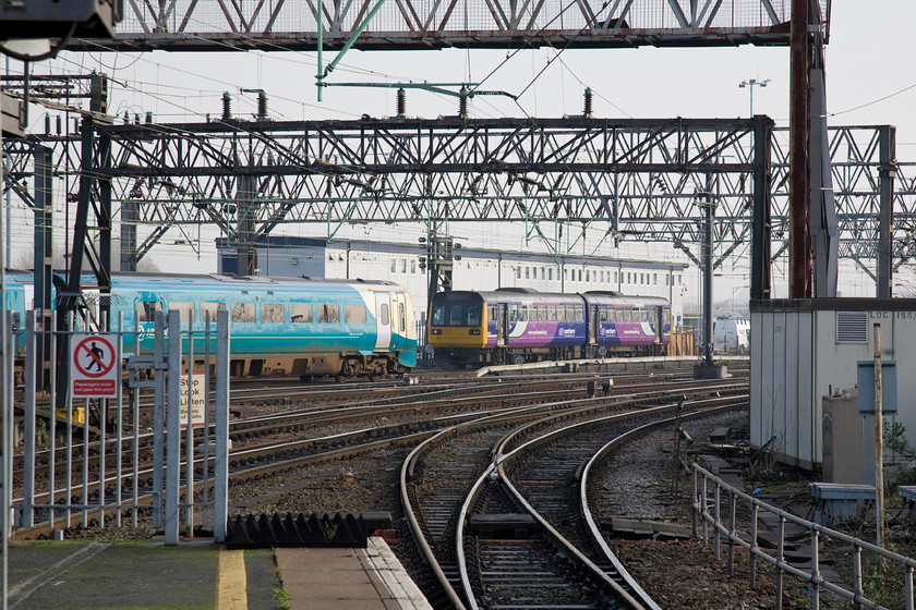 175114, AW 12.30 Manchester Piccadilly-Milford Haven (1V42) & 142146, NT 12.03 New Mills Central-Manchester Piccadilly (2S29), Manchester Piccadilly station 
 Ariva Trains Wales' 175114 starts its marathon journey from Manchester Piccadilly forming the 1V42 12.30 to Milford Haven. This 233 mile journey takes in a very interesting route passing through some amazingly diverse landscapes from the suburbs of Manchester, the Welsh Marches, the steel works of Port talbot to the stunning Towy Estuary. Meanwhile, 142146 arrives with the 12.03 from New Mills Central - a far more mundane service! 
 Keywords: 175114 12.30 Manchester Piccadilly-Milford Haven 1V42 142146 12.03 New Mills Central-Manchester Piccadilly 2S29 Manchester Piccadilly station