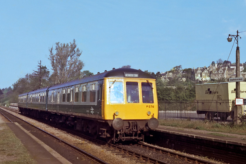 P576, unidentified Bristol Temple Meads-Weymouth, Bradford-on-Avon station 
 A visitor to Bradford-on-Avon. We were used to Cardiff and Bristol-based DMUs in our neck of the woods so the arrival of a Plymouth unit was a bit more unusual. P576 was a Class 119 three-car unit and is seen entering a sunny Bradford-on-Avon with an unidentified Weymouth working. Note the Ben Chairs delivery lorry parked in the station car park. This company manufactured dining room and office chairs in nearby Frome. Today, these chairs can be found for sale at quite extraordinary prices. 
 Keywords: Bradford-on-Avon Class 119 DMU P576