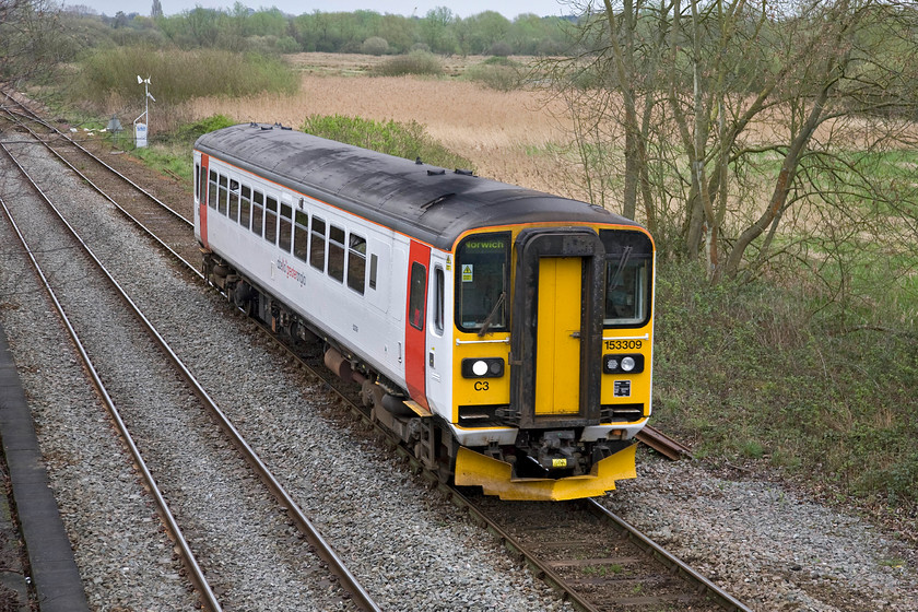 153309, LE 12.17 Great Yarmouth-Norwich (2P19), Whitlingham Lane crossing TG266083 
 153309 was seen earlier on its outward working to Great Yarmouth and is now seen again returning as the 12.17 return to Norwich. The Class 153 Super Sprinters are a valuable and useful asset to any rail operator being efficient and flexible in use. Greater Anglia has just announced that it will be refurbishing its fleet of units. 
 Keywords: 153309 12.17 Great Yarmouth-Norwich 2P19 Whitlingham Lane crossing TG266083 Abellio Greater Anglia