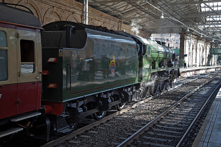 46100, outward leg of steam special, 10.37 Edinburgh Waverley-Carlisle (1Z64), Edinburgh Waverley station 
 46100 'Royal Scot' sits in the morning sun at Edinburgh Waverley's platform one. It is going to lead and unnamed steam special to Carlisle running as 1Z64. On leaving Waverley, it will head east to then take the Edinburgh Southside or Suburban line before taking Slateford Junction and then heading south west to Carstairs. After arrival at Carlisle, the train was diesel hauled back to Edinburgh whilst 46100 headed to Crewe with a support coach in tow. 
 Keywords: 46100 10.37 Edinburgh Waverley-Carlisle 1Z64 Edinburgh Waverley station