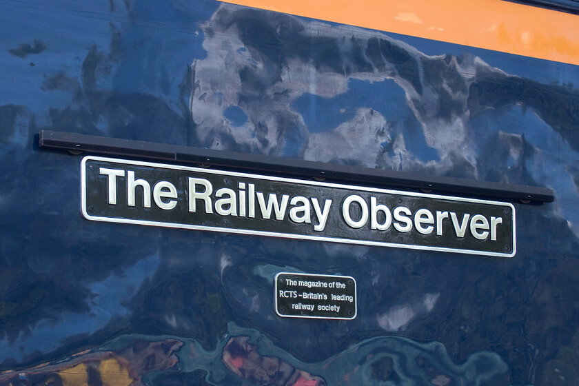 Nameplate (just named), 69003, on display, Barrow Hill 
 The Railway Observer is the name carried by the RCTS' monthly magazine. Re-built from 56018, 69003 is the fourth locomotive to carry this name with the plate having been unveiled a short time prior to this photograph being taken. The RCTS had partnered with Barrow Hill Roundhouse with the Saturday of the three-day 150 + 2 event being a Members' Day. RCTS members gained a reduced fee for access and a number of events, including the naming of 69003, took place. Andy and I met Mike at Barrow Hill as he is a long-term RCTS member. 
 Keywords: Nameplate just named 69003 on display Barrow Hill