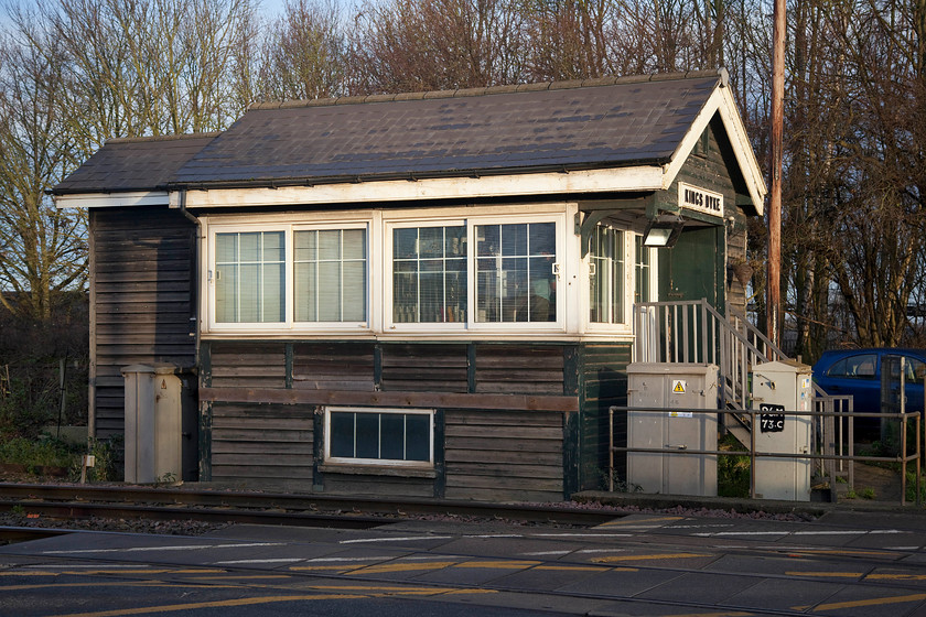 Kings Dyke signal box (GE, 1889) 
 I have a picture of Kings Dyke signal box taken in the 1980s, then it was very different being devoid of the ghastly upvc windows and cladding. It also did not have the toilet extension added at the western end. Today, the GER Dutton Type seven box controls two level crossings but no semaphores and it still retains its wooden nameboard. It is interesting to note that the name Kings Dyke is written with no apostrophe but on maps and locally it is written King's Dyke, once again like the next station Whittlesey, the railways have gone for their own spelling. 
 Keywords: Kings Dyke signal box Great Eastern Railway