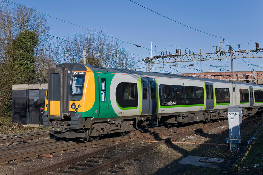 350260, LM 09.14 Birmingham New Street-London Euston, Northampton Station Car park 
 The 09.14 Birmingham New Street to London Euston London Midland service leaves Northampton worked by 350260. The photograph is taken from Northampton's station car park in bright winter sunshine. This was one of these superb and crisp winter days that offer the photographer superb crisp lighting. 
 Keywords: 350260 09.14 Birmingham New Street-London Euston Northampton Station Car park London Midland Desiro