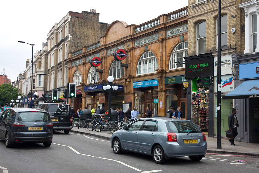 Frontage, Earls Court LU station 
 Most of the millions of passengers (and others) who use the eastern entrance of Earl's Court tube station will probably not even notice its superb architecture here on Earl's Court Road. The building was designed by Harry Ford the architect to the District Railway, it was opened in 1915. My wife and I had a lovely breakfast in a pub opposite from where I studied the architectural details! 
 Keywords: Frontage Earls Court LU station