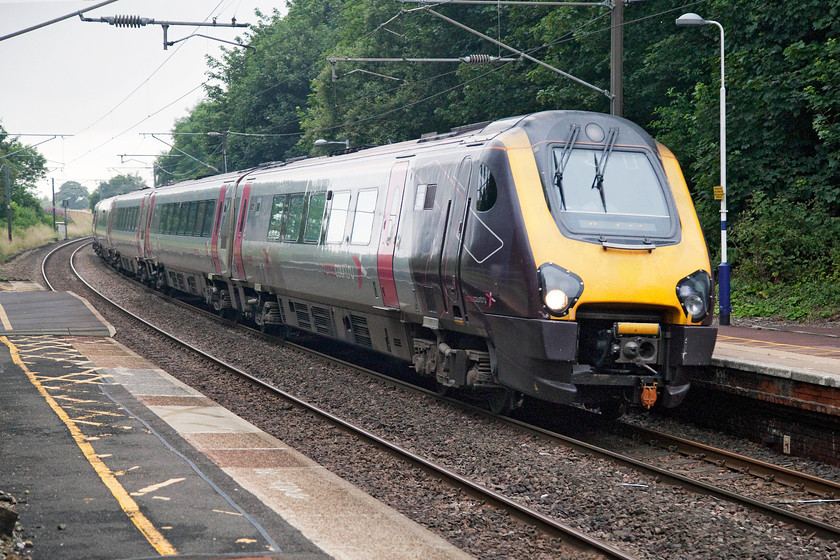 221135, XC 08.28 Penzance-Edinburgh Waverley (1S47, 12L), Pegswood station 
 221135 passes through Pegswood station forming the 08.28 Penzance to Edinburgh Waverley. A fascinating journey that is considerably further via the ECML rather than the more direct route north via the WCML. I have said it before, but I remain far from convinced that undertaking this journey in a glorified DMU would be a pleasurable experience? 
 Keywords: 221135 08.28 Penzance-Edinburgh Waverley 1S47 Pegswood station