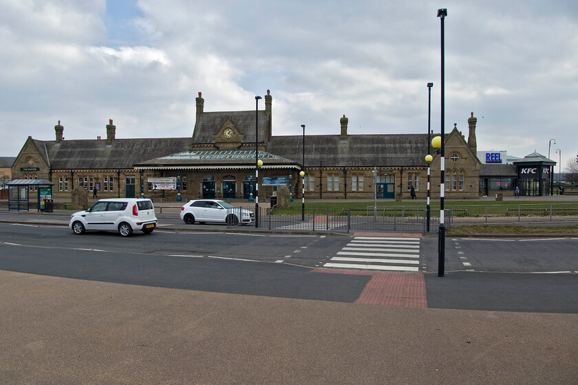 Frontage, former Morecambe station 
 The grand and impressive frontage of the former Morecambe Promenade station is an attractive building that was opened by the Midland Railway in 1907. It was a busy station for many years dealing with many holidaymakers visiting Morecambe for their holiday by the seaside or for onward transportation to the Isle of Man. With the decline in this trade, the station was hugely oversized for its now meagre shuttle service to and from Lancaster. It was eventually closed in 1994 and a small station opened a short distance to the east. The associated sidings were torn up and turned into car parking and retailing. Thankfully, the station survived and is now in use by KFC (of all things!) and as an arts and music venue, named appropriately The Station! 
 Keywords: Frontage former Morecambe station