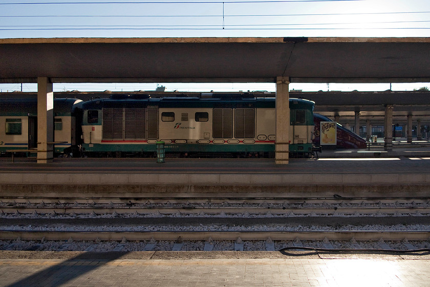 445.1116, 18.55 Florence SMN-Borgo SL (1199), Florence SMN station 
 A side view of 445.1116 as it waits at Florence SMN station waiting to leave with the 18.55 commuter service to Borgo San Lorenzo. These elderly and somewhat (on paper) underpowered diesels make a heck of a racket. This is largely down to the fact that they use supercharger to provide them with a bit more power that are notoriously noisy in service. 
 Keywords: 445.1116 18.55 Florence SMN-Borgo SL 1199 Florence SMN station