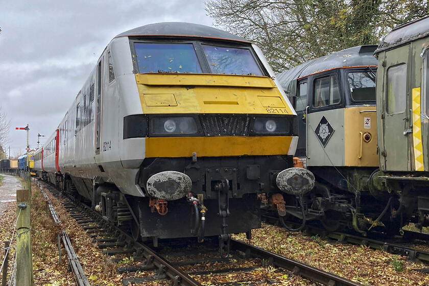 82114, 47205, 33053 & 31289, stabled, Pitsford & Brampton sidings 
 Looking a little incongruous deep in the Northamptonshire countryside former Greater Anglia DVT 82114 sits at the head of two Mk. III coaches. Last used on the GEML between Liverpool Street and Norwich the DVT and the stock arrived last year to form part of an air-braked set that the Northamptonshire and Lamport Railway has ambitions to operate perhaps with 47205, stabled adjacent, hauling? 
 Keywords: 82114 47205 33053 31289 Pitsford & Brampton sidings Greater Anglia DVT