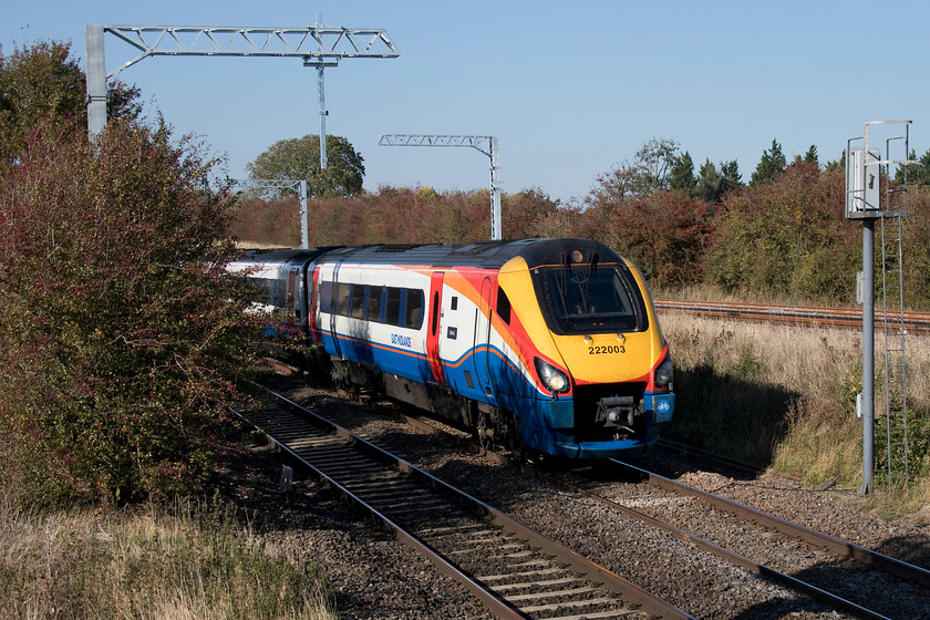 222003, EM 12.29 Sheffield-London St. Pancras (1C44, 26L), Irchester SP927667 
 222003 'Tornado' heads round the curve at Irchester with the 12.29 Sheffield to St. Pancras working under blue skies and newly installed electrification masts! This was the second train to come from Sheffield that was very late, this one arriving into St. Pancras some 26 minutes adrift. 
 Keywords: 222003 12.29 Sheffield-London St. Pancras 1C44 Irchester SP927667