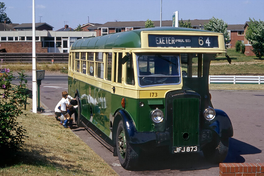 JFJ 873, 1949 Daimler, Hereford 
 Daimler bus JFJ 873 is seen receiving some attention at a garage located on the A49 to the south of Hereford. This bus is well known in the preserved bus fraternity and still does the rounds of the rallies today now being over seventy years old. It spent its entire working life on the roads around Exeter in revenue service for Devon General between 1949 and 1966. It has gone through a number of restorations and has had a number of owners since being preserved. 
 Keywords: JFJ 873 1949 Daimler Hereford