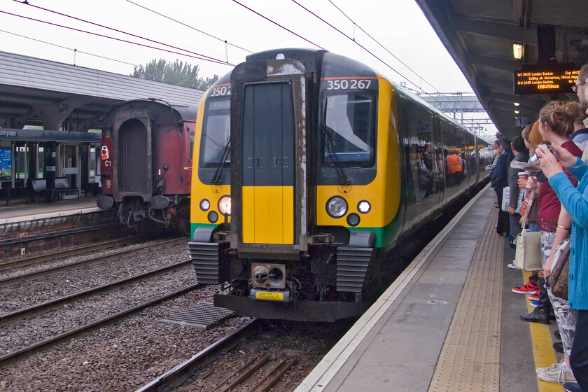 350267, LM 08.14 Birmingham New Street-London Euston (1Y16), Northampton station 
 With a packed Northampton station, 350267 arrives with the 08.14 Birmingham to Euston service that my wife and I took as far as Milton Keynes. Notice the tail of The Cheshireman charter just leaving from platform two which the crowded masses had just enjoyed the spectacle of 60009 'Union of South Africa' leading. 
 Keywords: 350267 08.14 Birmingham New Street-London Euston 1Y16 Northampton station London Midland Desiro